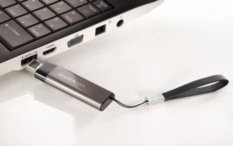 Laptop with a thumb drive.